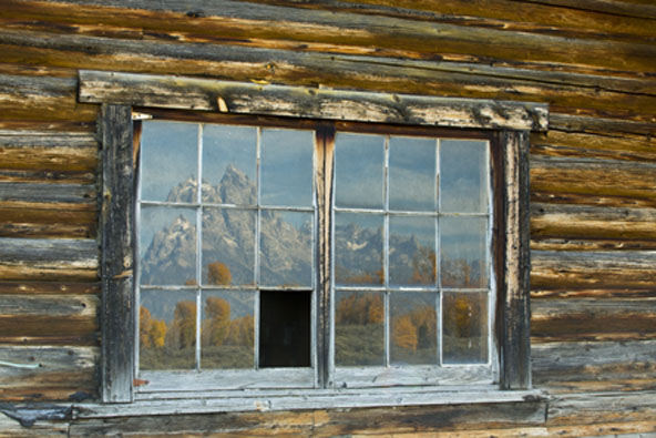 tetonns reflected in window