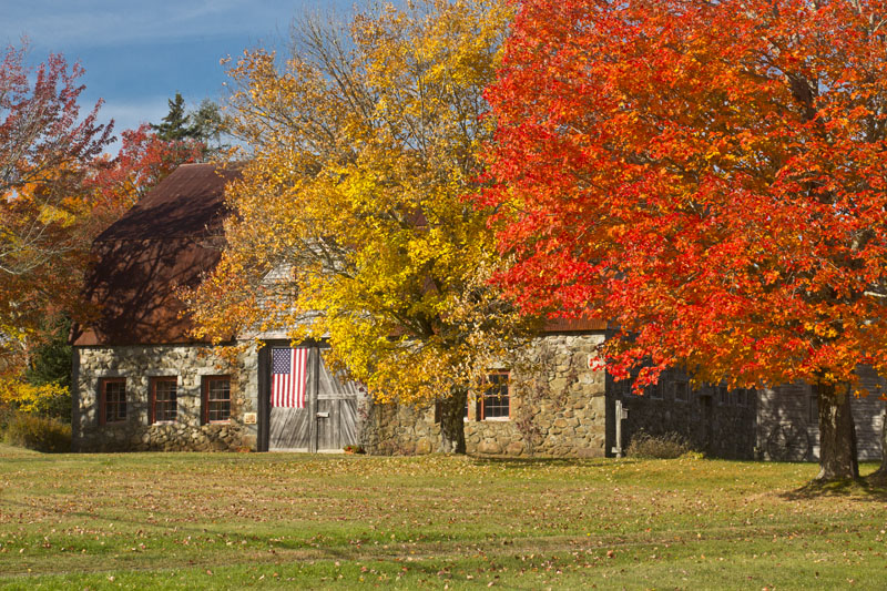 historic acadia stone barn in fall